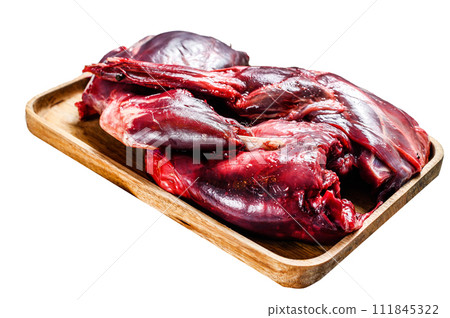 Hare meat. Raw fresh wild hare on a wooden table Isolated on white background. Top view. Hare meat. Raw fresh wild hare on a wooden table Isolated on white background. Top view. 111845322