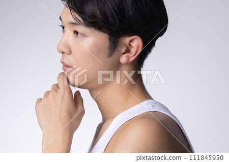 Upper body close-up portrait of a young man with white background Upper body close-up portrait of a young man with white background 111845950
