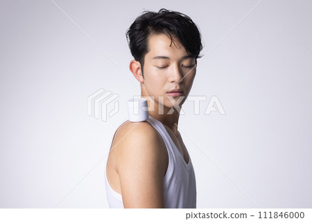 Image of a man with a white background holding cosmetics and skin care goods Image of a man with a white background holding cosmetics and skin care goods 111846000