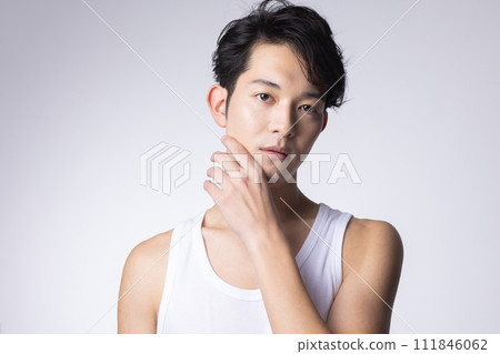 Upper body close-up portrait of a young man with white background 111846062