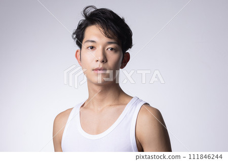 Upper body close-up portrait of a young man with white background 111846244