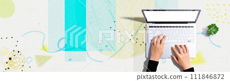 Person using a laptop computer Person using a laptop computer 111846872