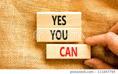Motivational and Yes you can symbol. Concept words Yes you can on beautiful wooden blocks. Beautiful canvas background. Businessman hand. Business motivational and Yes you can concept. Copy space. Motivational and Yes you can symbol. Concept words Yes you can on beautiful wooden blocks. Beautiful canvas background. Businessman hand. Business motivational and Yes you can concept. Copy space. 111847794