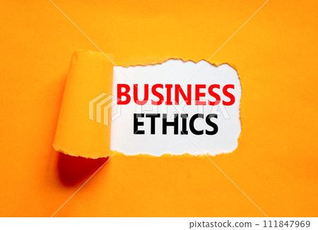 Business ethics symbol. Concept words Business ethics on beautiful white paper. Beautiful orange paper background. Business ethics concept. Copy space. Business ethics symbol. Concept words Business ethics on beautiful white paper. Beautiful orange paper background. Business ethics concept. Copy space. 111847969