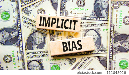 Implicit bias symbol. Concept words Implicit bias on wooden block. Beautiful background from dollar bills. Dollar bills. Business psychology implicit bias concept. Copy space. Implicit bias symbol. Concept words Implicit bias on wooden block. Beautiful background from dollar bills. Dollar bills. Business psychology implicit bias concept. Copy space. 111848026