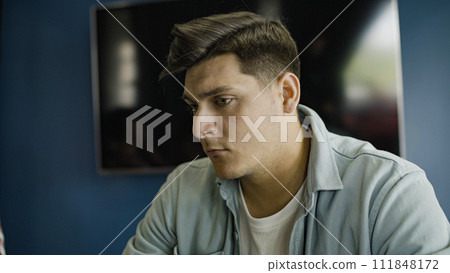 Young concentrated startup owner thinking about problem solution, brainstorming ideas Young concentrated startup owner thinking about problem solution, brainstorming ideas 111848172