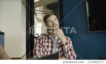 Young businessman in casual wear contemplating about project ideas, looking for problem solution Young businessman in casual wear contemplating about project ideas, looking for problem solution 111848173