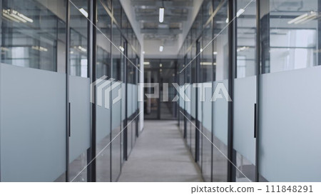 Empty hall of business office with glass doors, working place of big corporation Empty hall of business office with glass doors, working place of big corporation 111848291