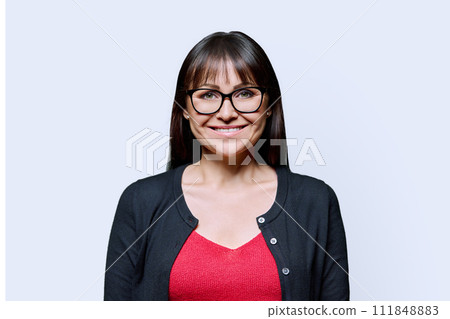 Portrait of smiling middle aged woman with on white background Portrait of smiling middle aged woman with on white background 111848883