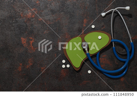 Paper liver mockup and stethoscope on dark gray background, space for text 111848950