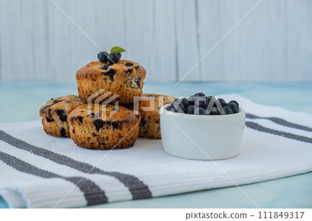 Homemade baked blueberry muffins with fresh blackberries. Tasty pastry sweet cupcake dessert. Berry pie cupcakes with organic berries. Gluten free healthcare recipe from alternative flour  111849317