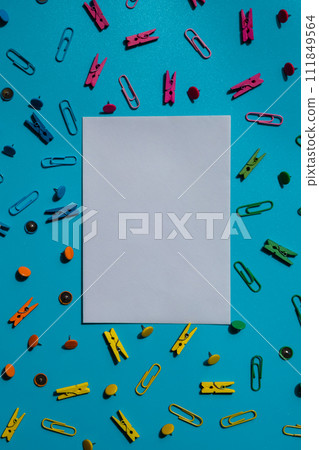 Empty white paper note frame border of school stationery supplies. Copy space for your text or Educational greeting announcement for students and teacher. Top view flat lay Creative vivid colorful Empty white paper note frame border of school stationery supplies. Copy space for your text or Educational greeting announcement for students and teacher. Top view flat lay Creative vivid colorful 111849564