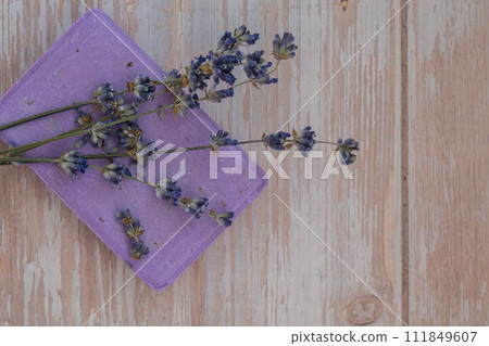 Handmade aromatic spa lavender soap. Natural additives and extracts. Bar of lavender soap with dried flowers. Beauty treatment product herbal ecological organic cosmetics 111849607