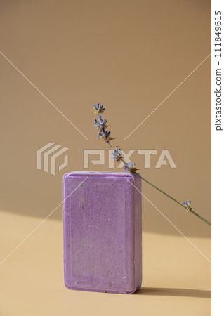 Handmade aromatic spa lavender soap. Natural additives and extracts. Bar of lavender soap with dried flowers. Beauty treatment product herbal ecological organic cosmetics Handmade aromatic spa lavender soap. Natural additives and extracts. Bar of lavender soap with dried flowers. Beauty treatment product herbal ecological organic cosmetics 111849615