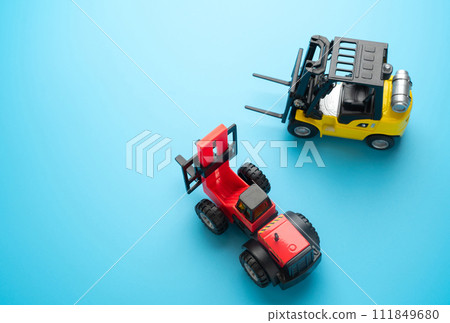 Forklifts and place for text. Efficient logistics and distribution systems. Warehouses, manufacturing facilities, and distribution centers. Forklifts and place for text. Efficient logistics and distribution systems. Warehouses, manufacturing facilities, and distribution centers. 111849680