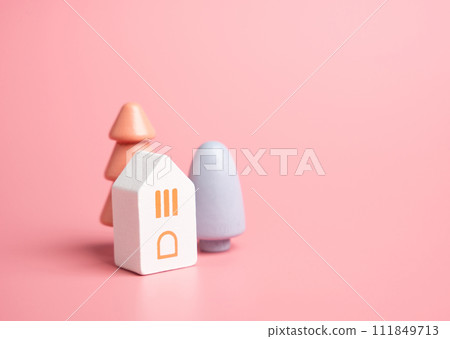 House and colorful trees, figures. Buy a house. Good housing. Mortgage. Cozy and gentle tones. Pastel pink colors. 111849713