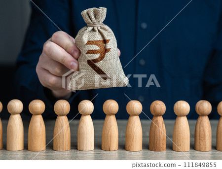 A man holds a indian rupee money bag above the crowd.Salaries. Crowdfunding and fundraising. Social politics. Deposits and loans. Budgetary funds for social policy. 111849855