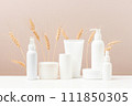 Cosmetic products on the table, white bottles and containers, mock-up scene 111850305