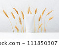 Cosmetic product on the table, white container for skin care decorated wheat ears 111850307