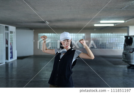Talented young woman dancing Hip hop dance in parking garage. Hobby and active lifestyle concept Talented young woman dancing Hip hop dance in parking garage. Hobby and active lifestyle concept 111851197