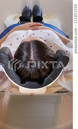 Female patient undergoing MRI - Magnetic resonance imaging in Hospital with motion blur effect Female patient undergoing MRI - Magnetic resonance imaging in Hospital with motion blur effect 111851559