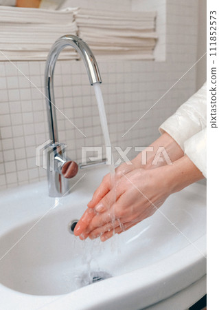 Hands wash procedure, cleaning hands with soap from viruses and contamination. Wash hands before dinner 111852573
