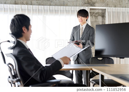 A businessman praised by his boss 111852956