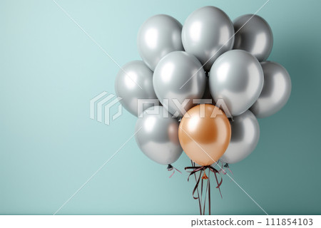 Bunch of silver metallic helium balloons and one golden one among them. The concept of uniqueness 111854103