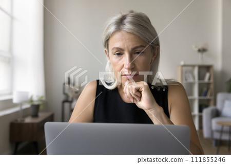 Businesswoman read received e-mail from client working using laptop Businesswoman read received e-mail from client working using laptop 111855246