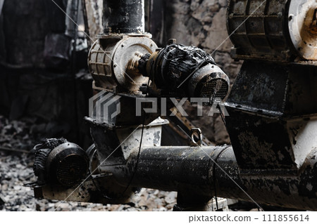 Close Up of a Pipe on a Construction Site after fire 111855614