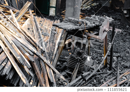 Burned Wood Pile Next to Building Burned Wood Pile Next to Building 111855621
