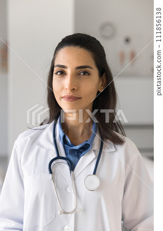 Positive beautiful young practitioner woman vertical portrait Positive beautiful young practitioner woman vertical portrait 111856138