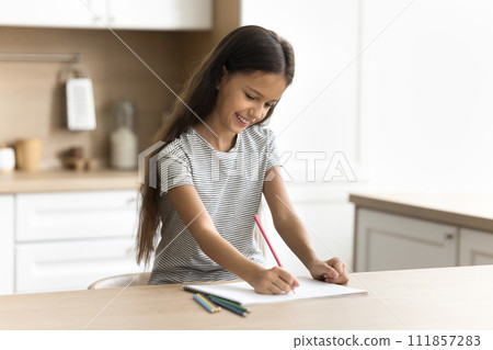 Cheerful little artist kid drawing funny picture in colorful pencils Cheerful little artist kid drawing funny picture in colorful pencils 111857283