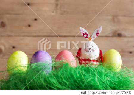 Row of colorful Easter eggs and bunny rabbit 111857528