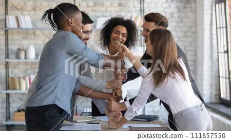Young professionals relaxing and doing team building activities at work 111857550