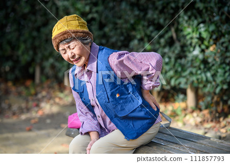 woman suffering from back pain woman suffering from back pain 111857793