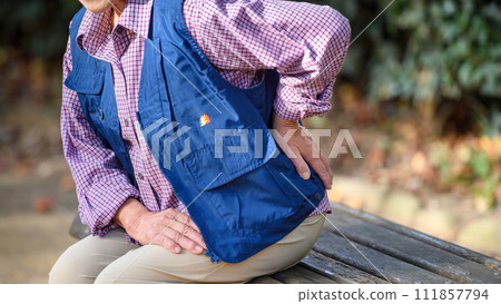 woman suffering from back pain woman suffering from back pain 111857794