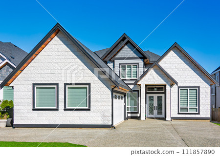 A perfect neighbourhood. Brand new luxury family house on bright winter day A perfect neighbourhood. Brand new luxury family house on bright winter day 111857890