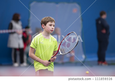 Little boy with a tennis racket. The child plays tennis. 111859316