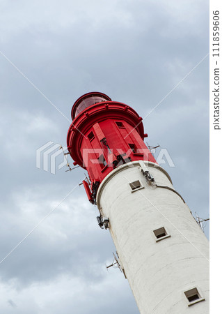 Equipment on a red and white lighthouse in France 111859606