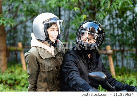 men and women riding motorcycles 111859624