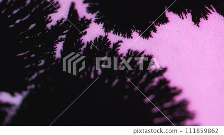 Ink drop paint splatter black stain blotch on pink Ink drop paint splatter black stain blotch on pink 111859862