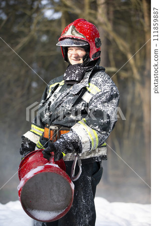Firefighters extinguish a fire. Firefighter in the forest. 111859887