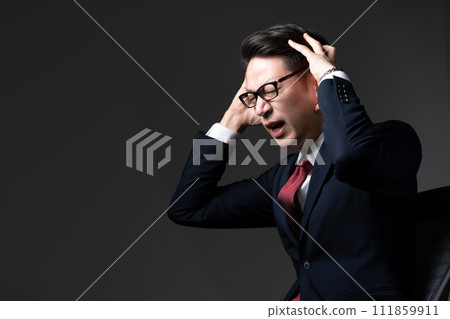 Businessman with a surprised expression Businessman with a surprised expression 111859911