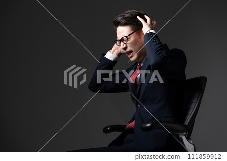 Businessman with a surprised expression Businessman with a surprised expression 111859912