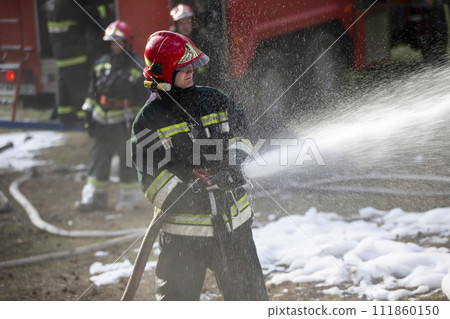 Belarus, the city of Gomil, April 06, 2017.Forest. Firefighters extinguish a fire. A team of firefighters on a background of smoke and a fire engine Belarus, the city of Gomil, April 06, 2017.Forest. Firefighters extinguish a fire. A team of firefighters on a background of smoke and a fire engine 111860150