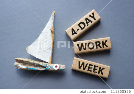 4-day work week symbol. Concept words 4-day work week on wooden blocks. Beautiful grey background with boat. Business and 4-day work week concept. Copy space 111860536