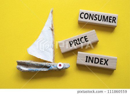Consumer Price Index symbol. Concept words Consumer Price Index on wooden blocks. Beautiful yellow background with boat. Business and Consumer Price Index concept. Copy space. 111860559