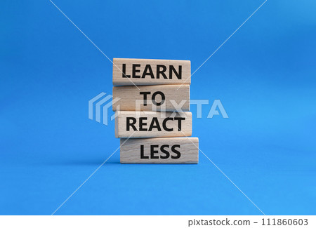 Learn to react Less symbol. Wooden blocks with words Learn to react Less. Businessman hand. Beautiful blue background. Business and Learn to react Less. Copy space. 111860603