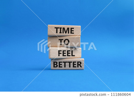 Time to feel better symbol. Wooden blocks with words Time to feel better. Beautiful blue background. Medicine and Time to feel better concept. Copy space. 111860604
